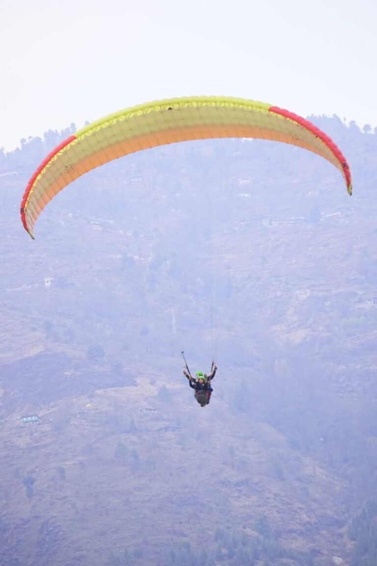 paragliding misty mountains himachal